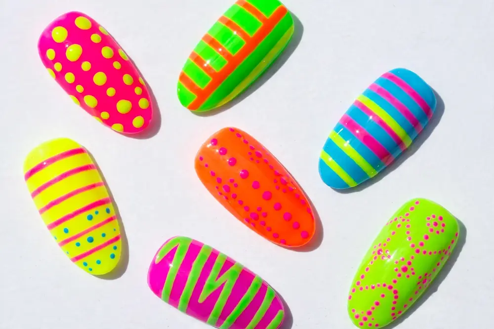 Bright neon nail art designs in hot pink, lime and orange